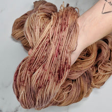 Load image into Gallery viewer, hand-dyed yarn in a variegated tonal colorway of rosey tonal browns with flashes of dark rose and chestnut brown
